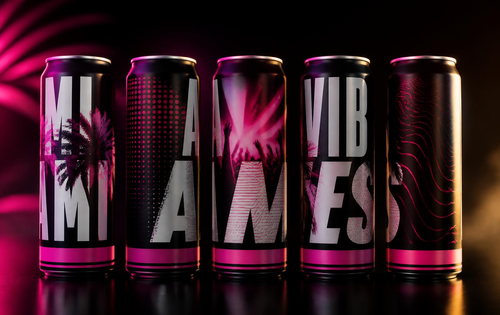 Collector aluminum cans lit in magenta on a black stage